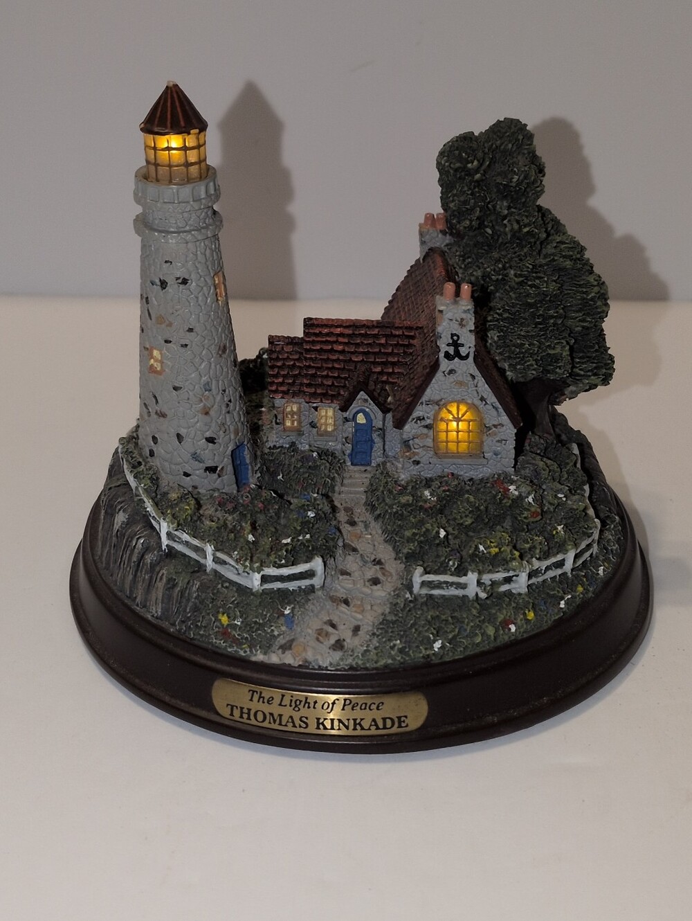 Thomas Kinkade "The Light of Peace" Light Up Lighthouse Figure. 4.5" Tall x 5" R